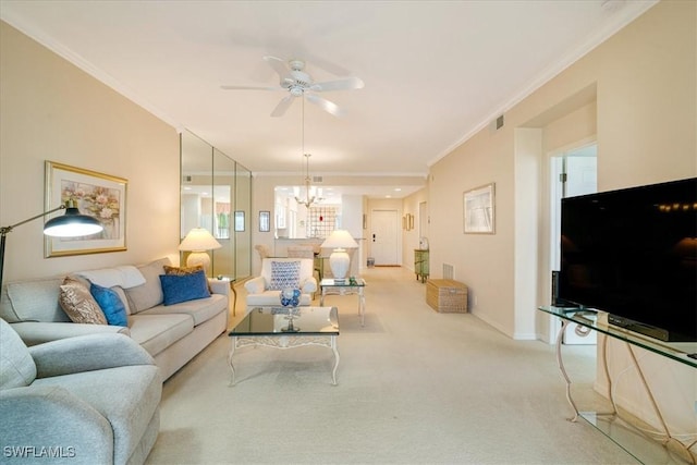 carpeted living room with ceiling fan with notable chandelier and crown molding