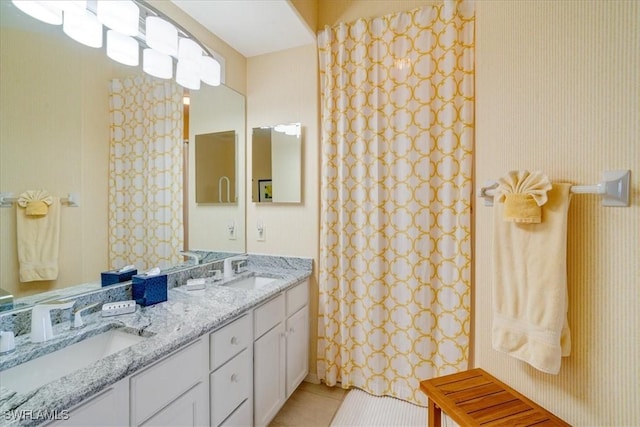 bathroom featuring tile patterned flooring and vanity