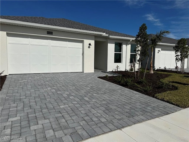 single story home featuring a garage