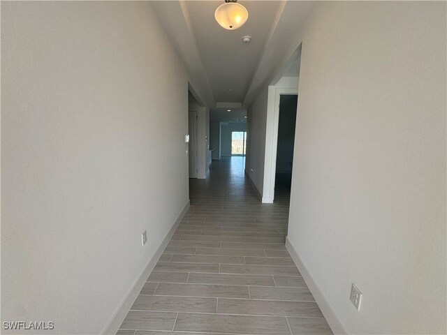 hallway with light hardwood / wood-style flooring