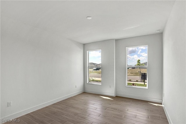 44488 Little Blue Heron Way, Punta Gorda, FL 33982 - unfurnished room with wood finished floors and baseboards