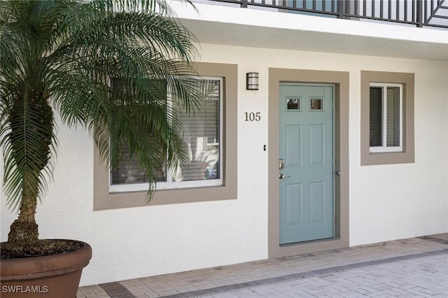 property entrance with a balcony