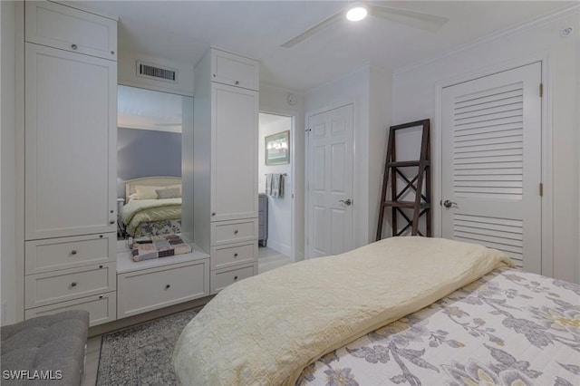 bedroom featuring ceiling fan and crown molding