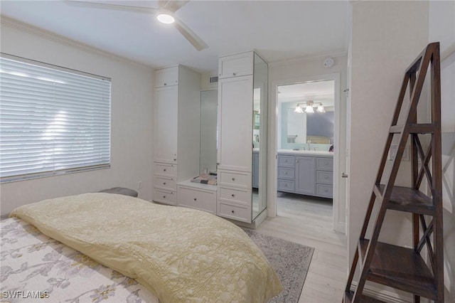 bedroom featuring ensuite bathroom, crown molding, sink, ceiling fan, and light wood-type flooring