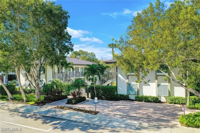 view of property hidden behind natural elements