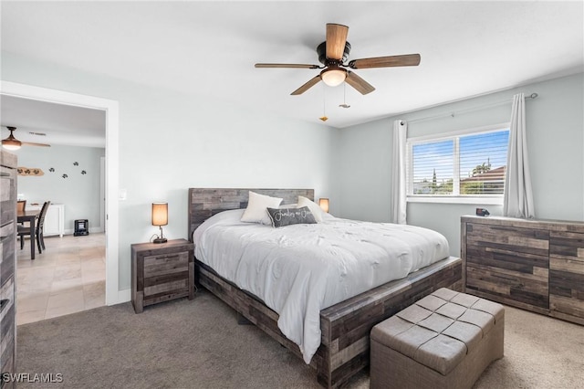 bedroom featuring light carpet and ceiling fan