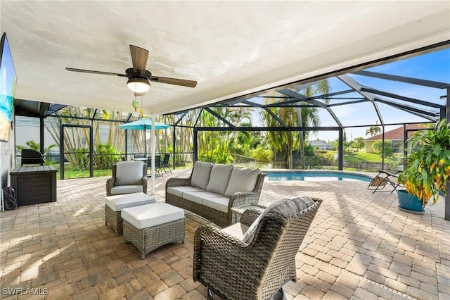 view of patio with outdoor lounge area, glass enclosure, and a grill