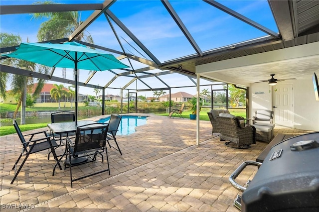 view of patio with ceiling fan and a lanai