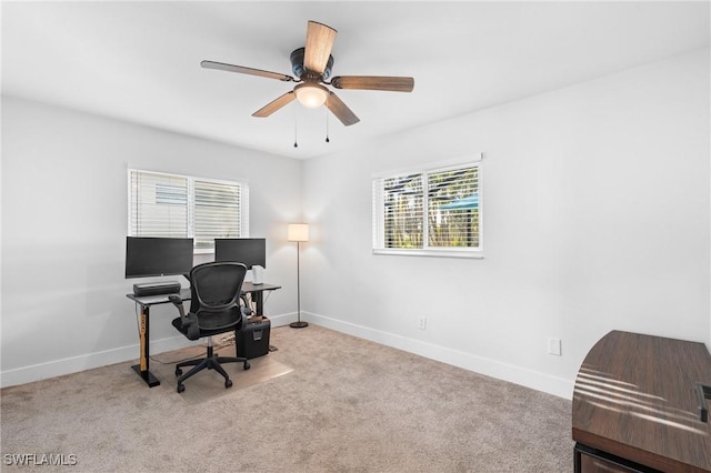 carpeted office with ceiling fan