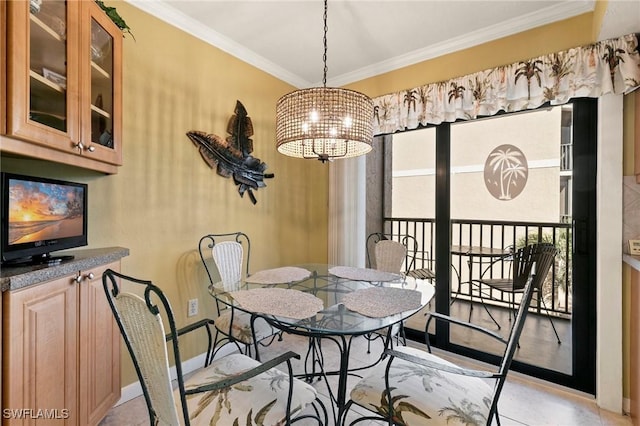 dining room featuring crown molding and a chandelier