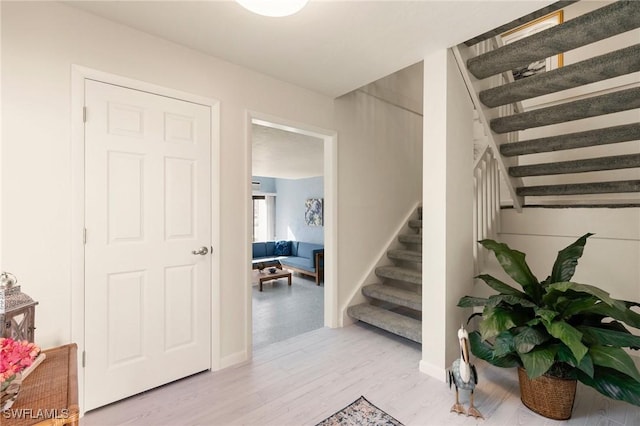 stairway featuring hardwood / wood-style flooring