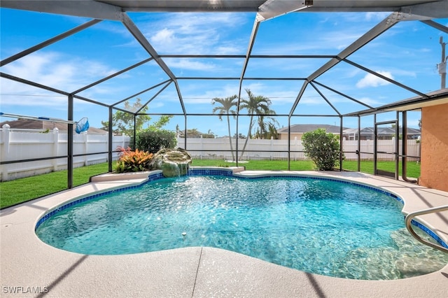 view of pool featuring a yard, pool water feature, and a lanai