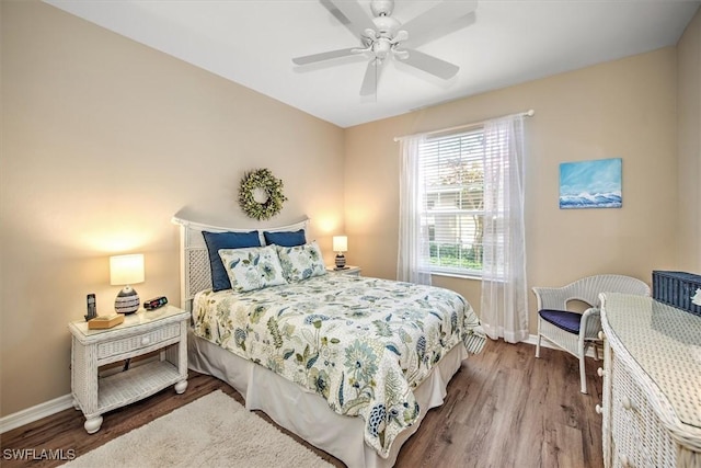 bedroom featuring hardwood / wood-style flooring and ceiling fan