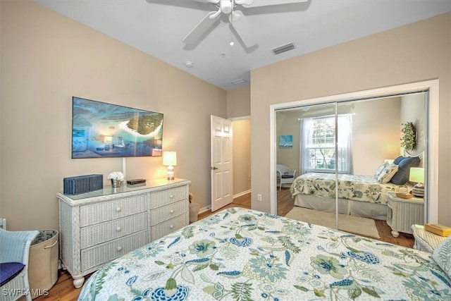 bedroom featuring hardwood / wood-style flooring, a closet, and ceiling fan