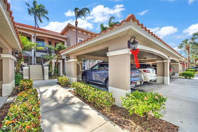 view of parking / parking lot featuring a carport