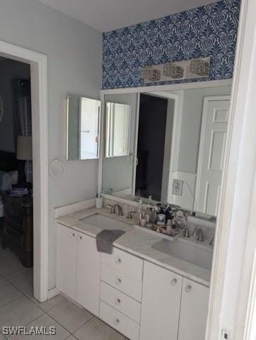 bathroom with tile patterned floors and vanity