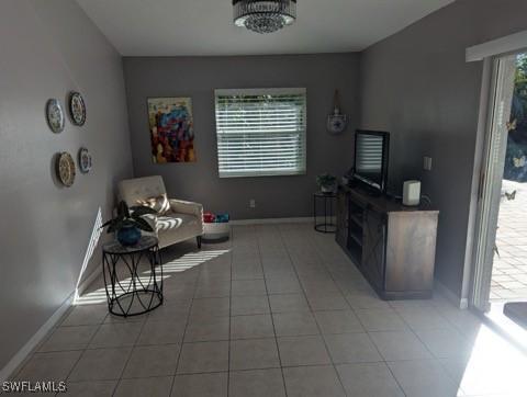 living area featuring light tile patterned floors