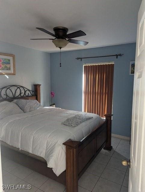 bedroom with ceiling fan and light tile patterned flooring