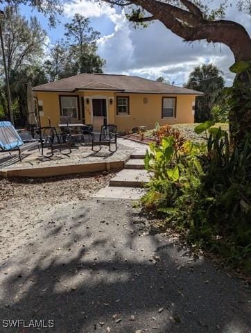 back of property with a wooden deck