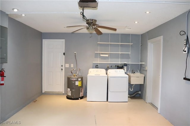 clothes washing area with electric water heater, sink, ceiling fan, and independent washer and dryer