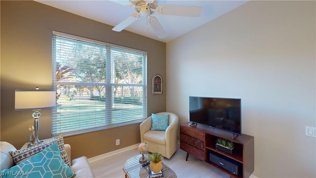 sitting room featuring ceiling fan