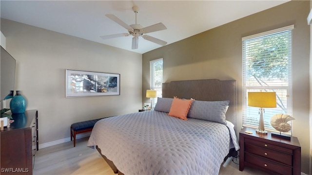 bedroom featuring light wood-type flooring and ceiling fan