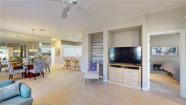 living room featuring ceiling fan