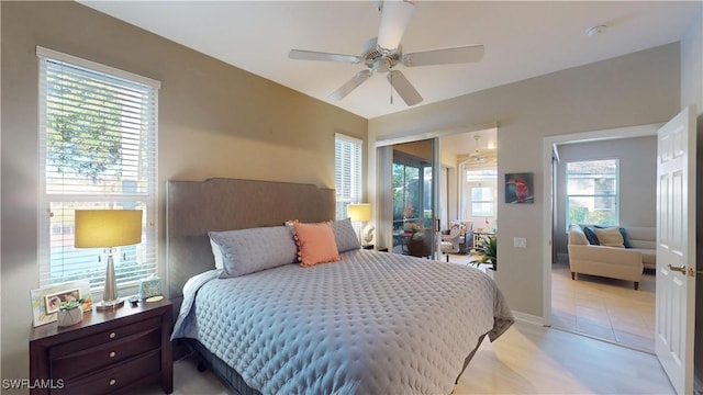 bedroom featuring ceiling fan and multiple windows