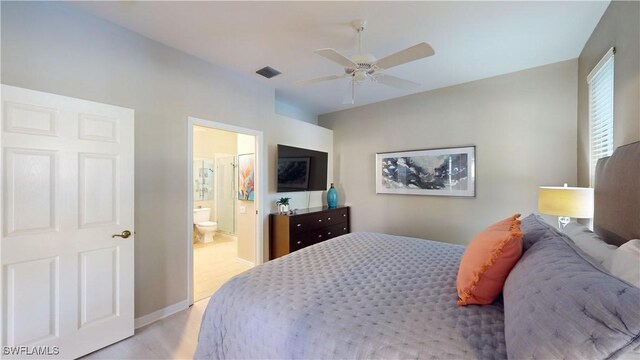 bedroom with ceiling fan and ensuite bath