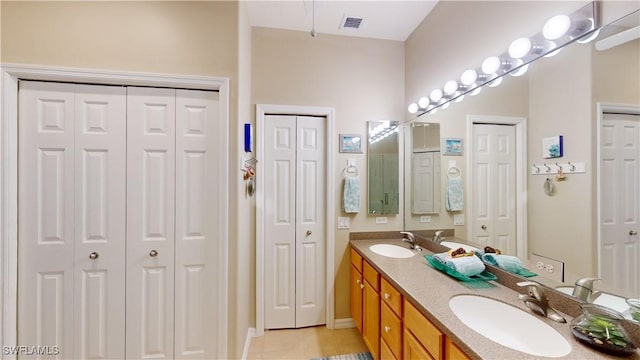 bathroom featuring tile patterned floors and vanity