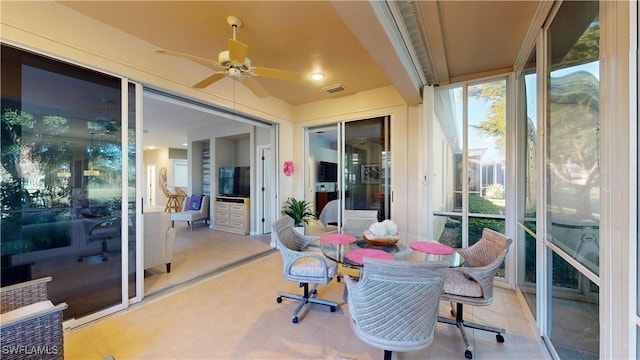 sunroom / solarium with ceiling fan