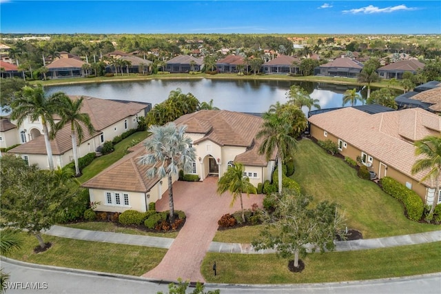 bird's eye view with a water view and a residential view