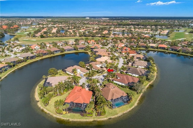 birds eye view of property with a water view and a residential view