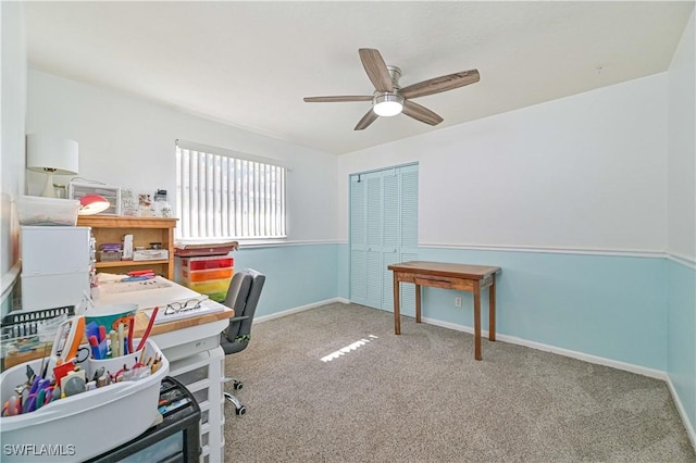 office featuring ceiling fan and light carpet