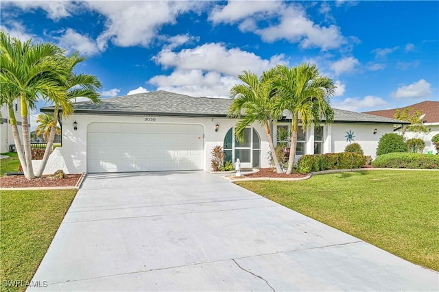 single story home featuring a garage and a front lawn