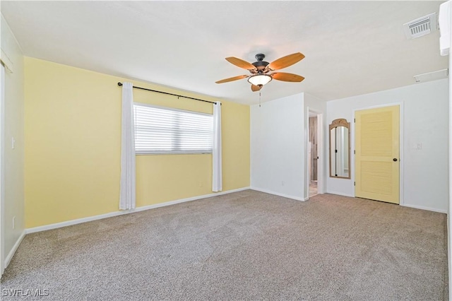 unfurnished room with ceiling fan and light colored carpet