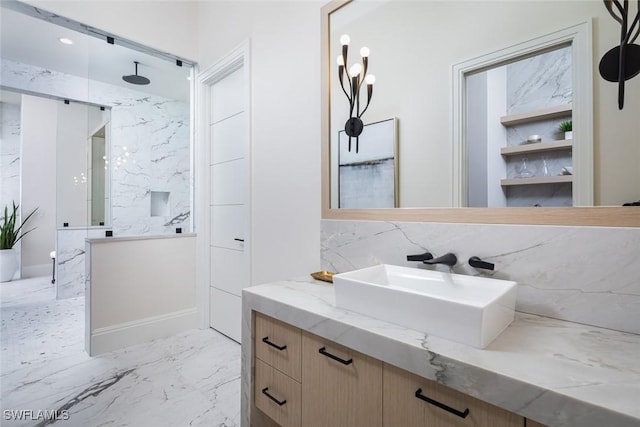 bathroom featuring a shower and vanity