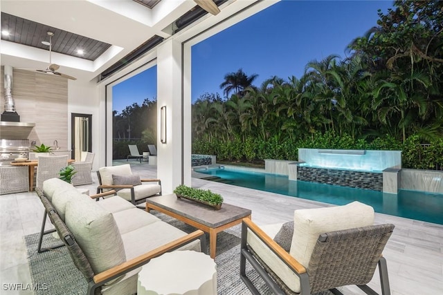 view of patio featuring pool water feature, ceiling fan, and grilling area