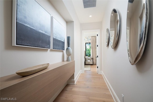 corridor with light wood-type flooring