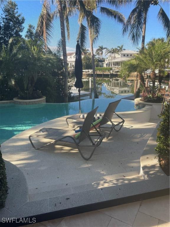 view of pool featuring a patio area