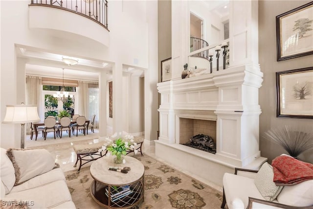 living room featuring a chandelier and a high ceiling