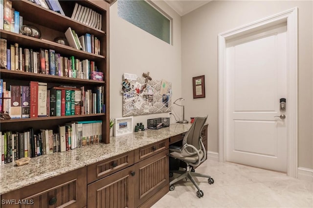 tiled office space featuring built in desk