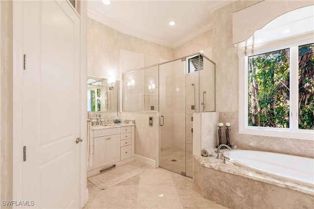 bathroom featuring vanity, ornamental molding, and shower with separate bathtub