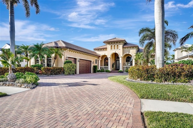 mediterranean / spanish-style home featuring a garage