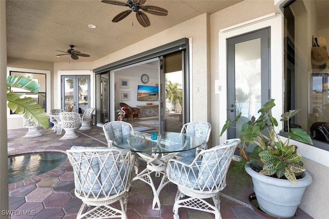 view of patio with ceiling fan and french doors