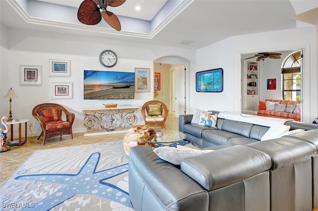 living room with ceiling fan and light tile patterned flooring