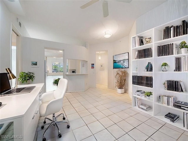 office space featuring light tile patterned floors and ceiling fan