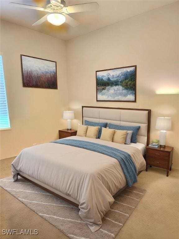 bedroom with ceiling fan and carpet