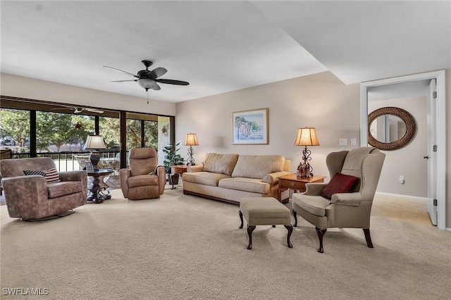 living room featuring light carpet and ceiling fan