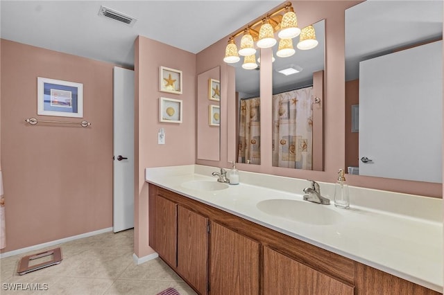 bathroom with vanity and tile patterned floors